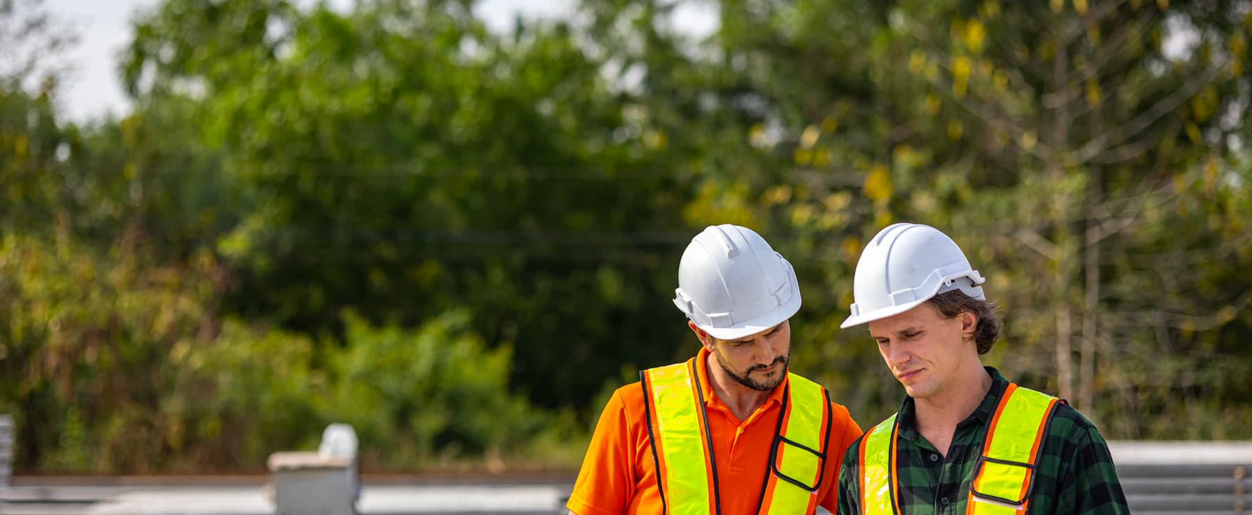 Construction supervisors reviewing project information together